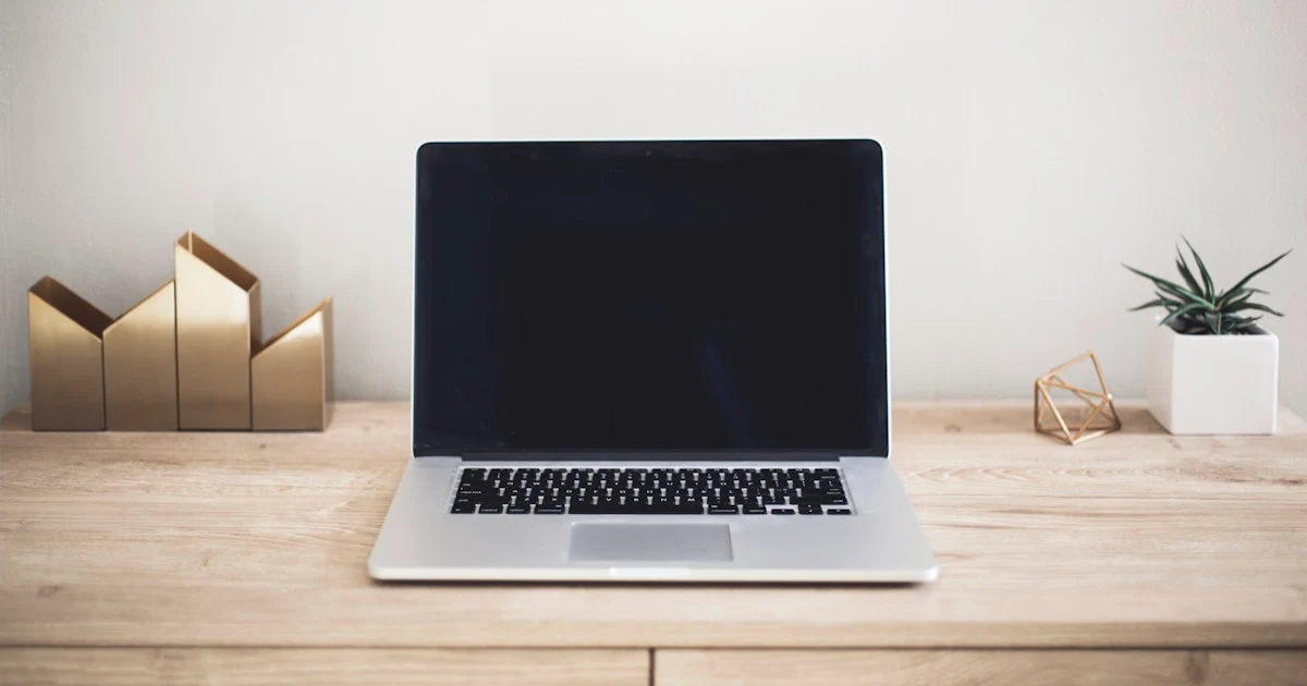 Person working on a laptop in a professional setting